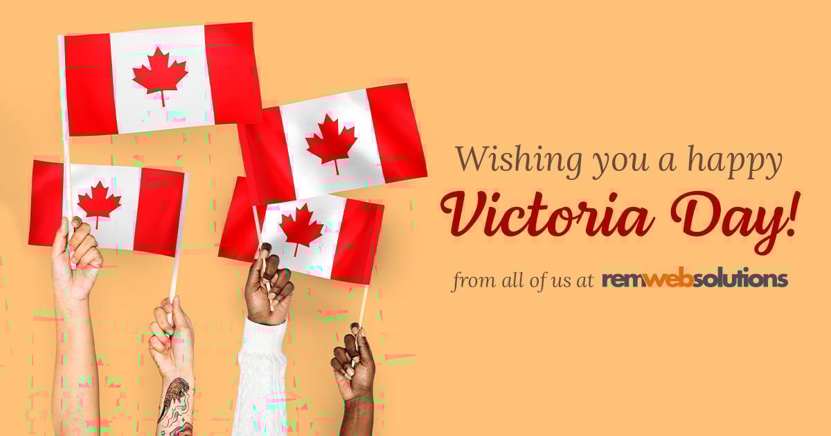 Diverse group of people holding up Canadian flags